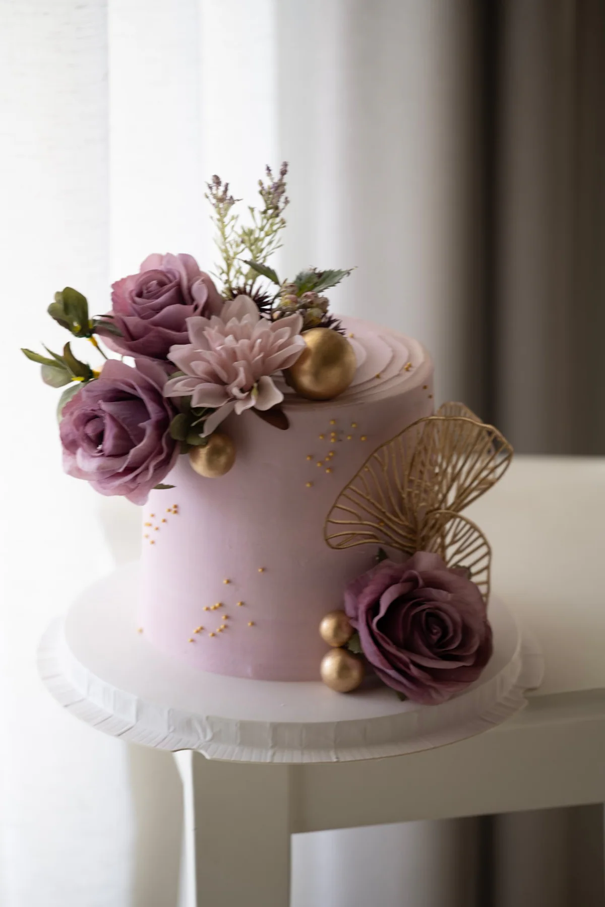 Lavender floral cake with gold botanical accents