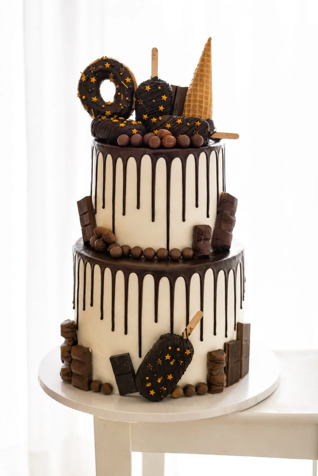 Ivory and chocolate two-tier drip cake