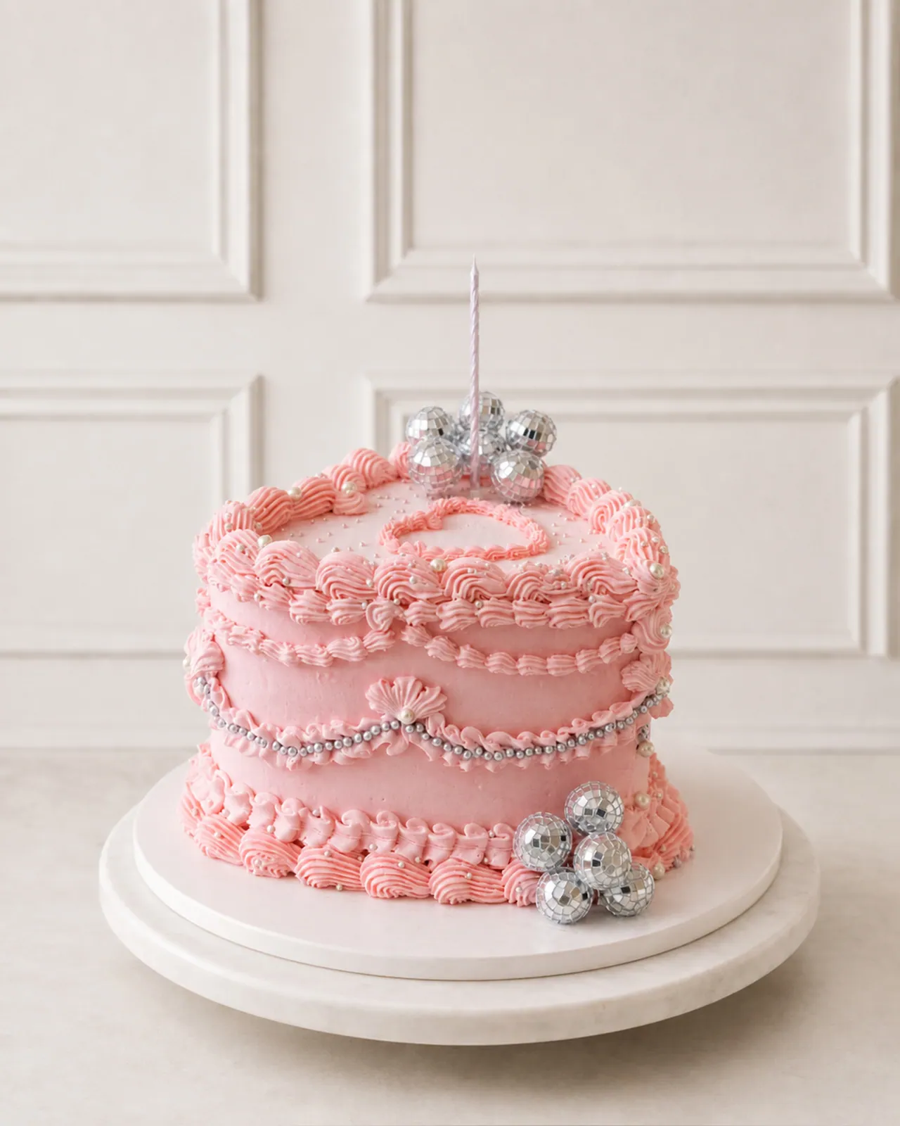 Pink piped cake with silver baubles