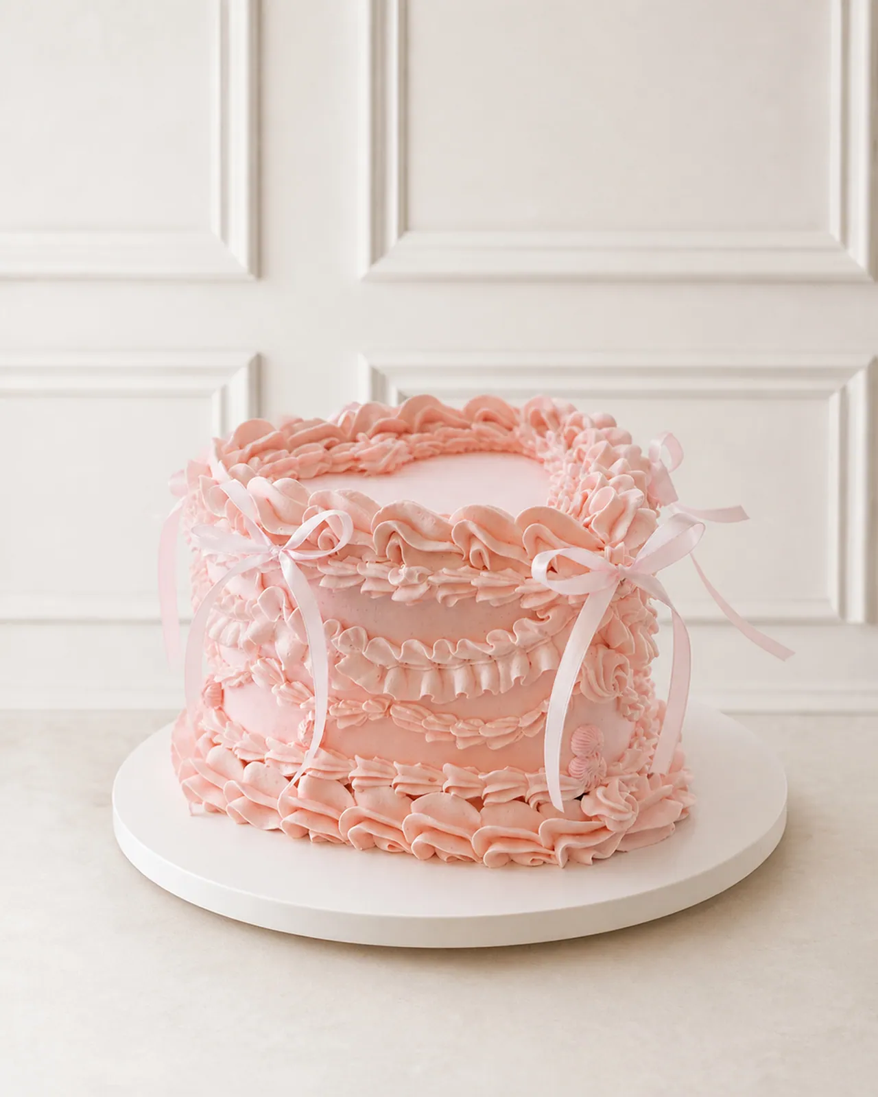 Pink ruffle cake with ribbon