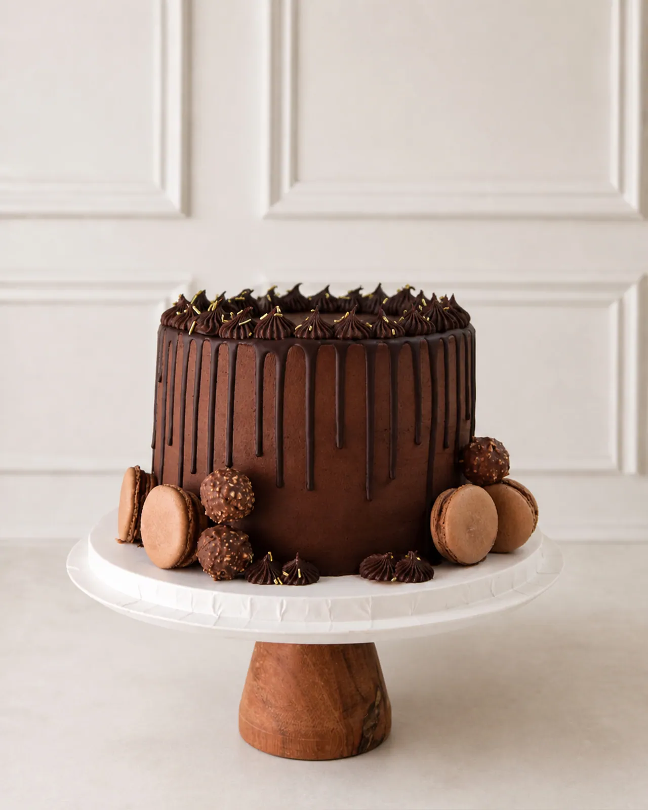 Dark chocolate drip cake with truffles