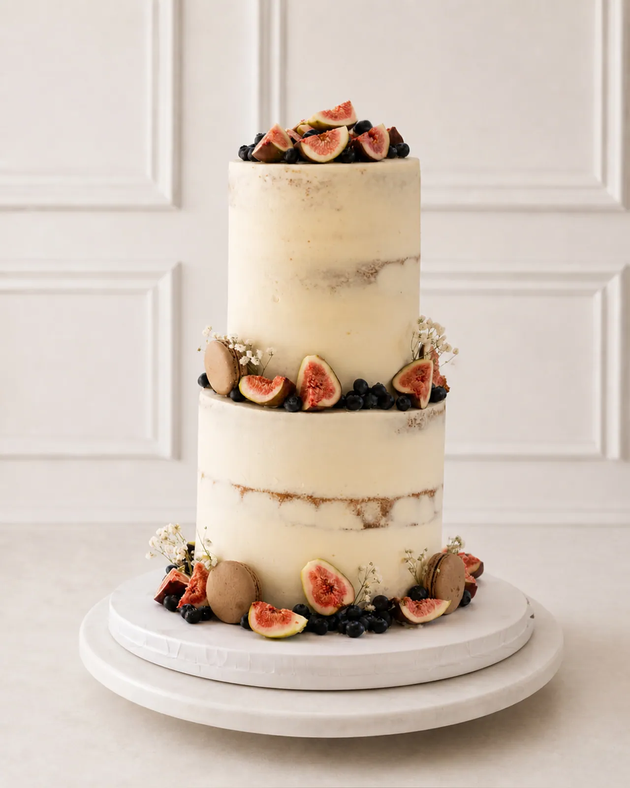 Two-tier semi-naked cake with figs